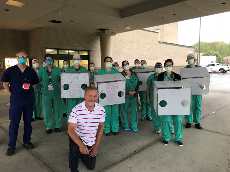 Dave Kashy standing with hospital staff