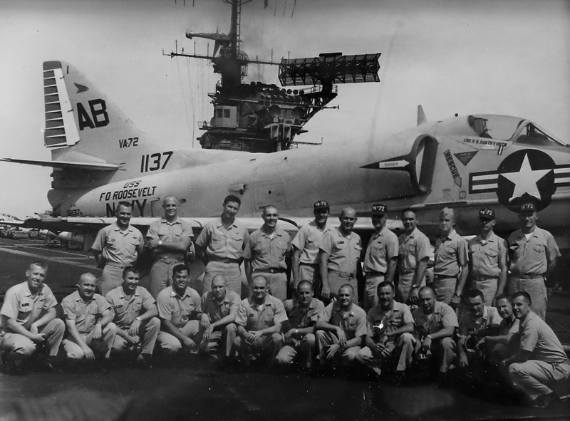 Navy squad in front of plane