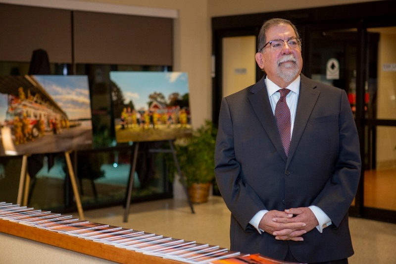 Michael Taylor in front of paintings