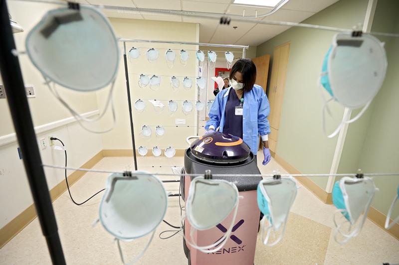 Hospital staff working on UV machine