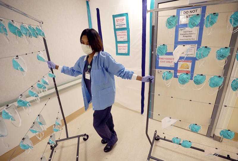 hospital staff preparing face masks to be sanitized