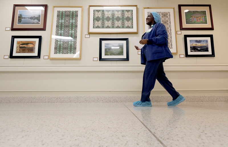 Visitor walking past shoreline art gallery