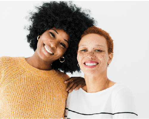 two women smiling together