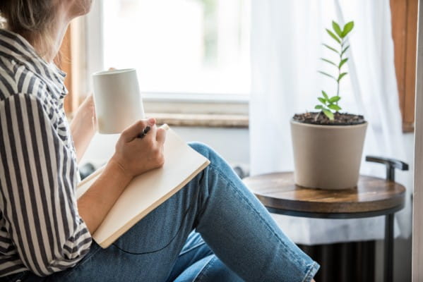 woman sitting and journaling