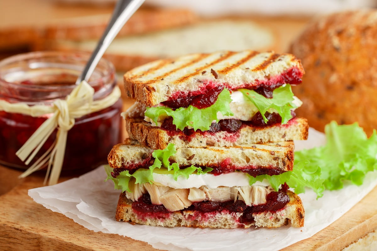 Delicious Turkey sandwich with brie, lettuce and cranberries