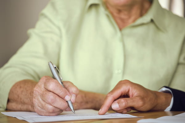 Woman signing documents